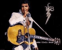 elvis presley is singing into a microphone while holding an acoustic guitar .