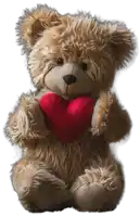 a teddy bear holding a red heart in its paws