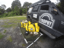 the word trophy is on the side of a black vehicle