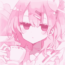 a girl with pink hair is holding a cup with a heart on it