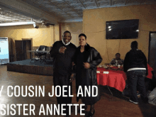 cousin joel and sister annette pose for a picture in a room