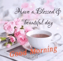 a cup of coffee and pink flowers are on a table with a good morning message .