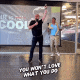 two men dancing in front of a projector screen that says hr is not cool