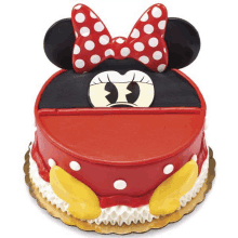 a minnie mouse cake with a red bow and ears