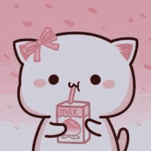 a cartoon cat with a bow on its head is drinking a box of milk through a straw .