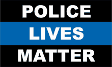 a sign that says police lives matter in white letters