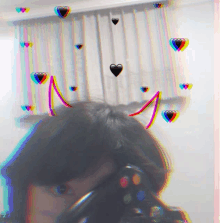 a girl taking a selfie with hearts and the letter n