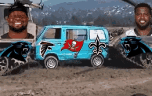 two men are standing next to a blue van with the logos for the panthers falcons and buccaneers on it