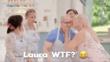 a woman kissing a man on the cheek with the words laura wtf below her