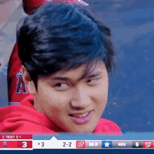 a baseball game is being played between the angels and the washington nationals and the score is 3-2