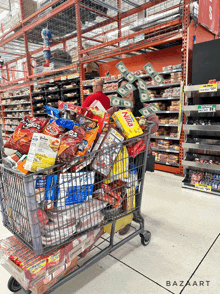 a shopping cart full of snacks including nilla