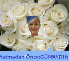 a picture of a woman surrounded by white roses