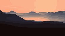 a sunset over a mountain range with the sun setting behind the mountains