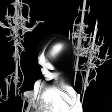 a black and white photo of a woman surrounded by skeletons and candles .