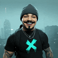 a man wearing a beanie and a t-shirt with an x on it