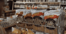 a grocery store shelf filled with bags of potato chips including a bag that says ' potato fire ' on it