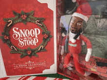 a snoop on the stoop doll is next to a dvd