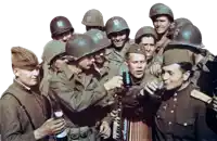 a group of soldiers are gathered around a man playing an accordion and drinking beer