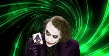 the joker is holding a playing card with a gorilla on it