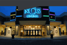 the entrance to the ncg cinema is lit up