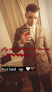 a man in a suit takes a picture of himself in a mirror with the caption " my cutie protocol all dressed up "