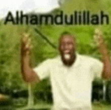 a blurry picture of a man with his arms in the air and the words alhamdulillah .