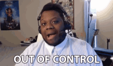 a man wearing headphones says out of control while looking at the camera