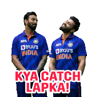 two men wearing blue jerseys that say byju 's india