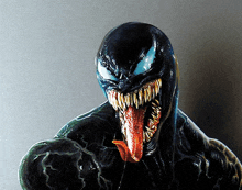 a statue of venom with his tongue out