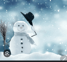 a snowman wearing a black hat and scarf is in the snow