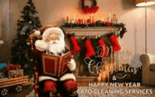 santa claus is sitting in a chair reading a book in front of a fireplace and christmas tree .