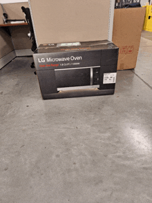 an lg microwave oven is sitting on the floor