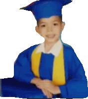 a young boy wearing a blue cap and gown