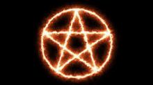 a pentagram is surrounded by flames on a black background and is glowing .