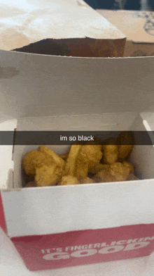 a box of chicken nuggets and french fries with a caption that says im so black