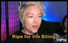 a woman wearing headphones says " ripe for the biting " in yellow letters