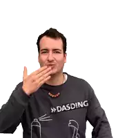 a man wearing a dasding sweatshirt is smiling and waving