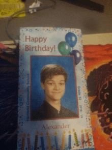 a birthday card for alexander with a picture of him