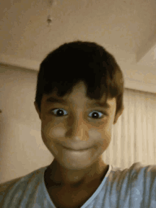 a young boy making a funny face with his mouth open