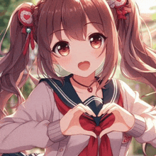 a girl with pigtails is making a heart with her hands .