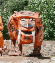 a statue of a tiger with a smiling face and teeth