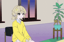 a girl in a yellow sweater sits in front of a potted plant