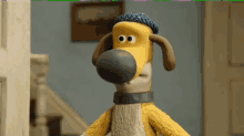 a cartoon dog wearing a blue hat and a collar