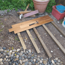 a wooden plank with a hammer on it