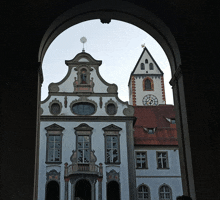 a large white building with a clock tower on top of it