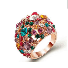 a ring with a bunch of colored stones on it