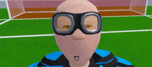 a bald man wearing goggles stands in front of a soccer field