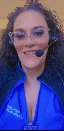 a woman wearing glasses and a headset with the word valley on the front