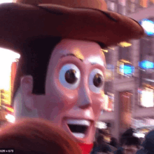 a close up of a toy story woody with a cowboy hat