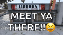 a liquors store with a sign that says meet ya there